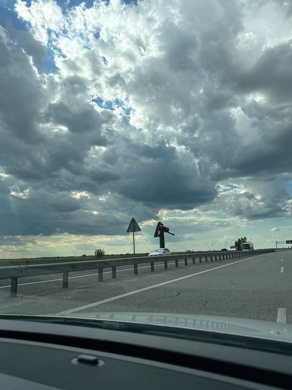 Storm clouds gather over a Ukrainian highway stretch