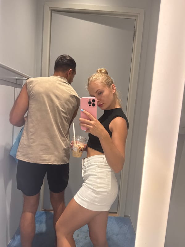 Couple browses and poses in a Nha Trang fitting room