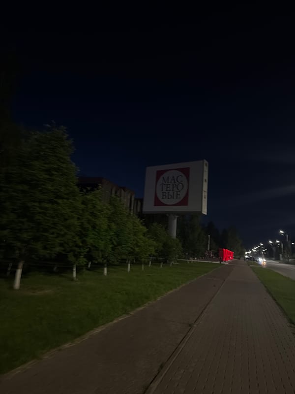 Two women take evening stroll through illuminated Naberezhnye Chelny streets