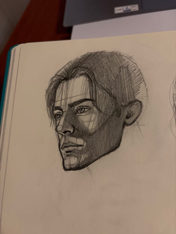 Artist sketches portrait in notebook in Izhevsk