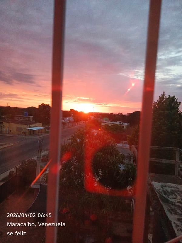 Sunset captured over Maracaibo, Venezuela through window