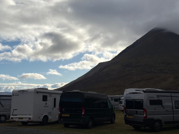 Morning campervan gathering at Isle of Skye mountain campsite