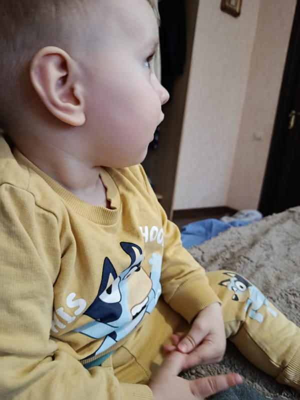 Toddler observed in quiet domestic moment indoors