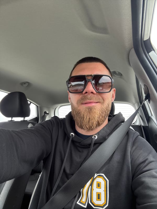 Man in numbered hoodie photographed in car, Bulgaria