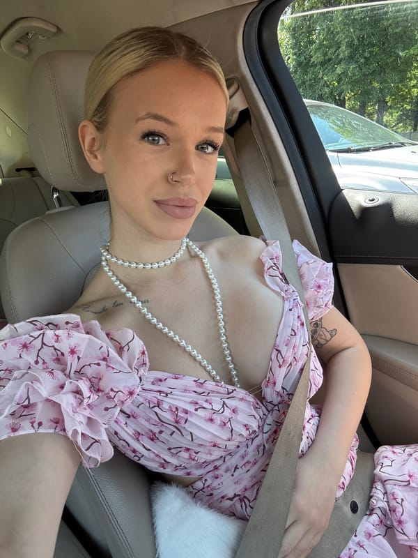 Passenger in floral dress, riding through Saint Petersburg