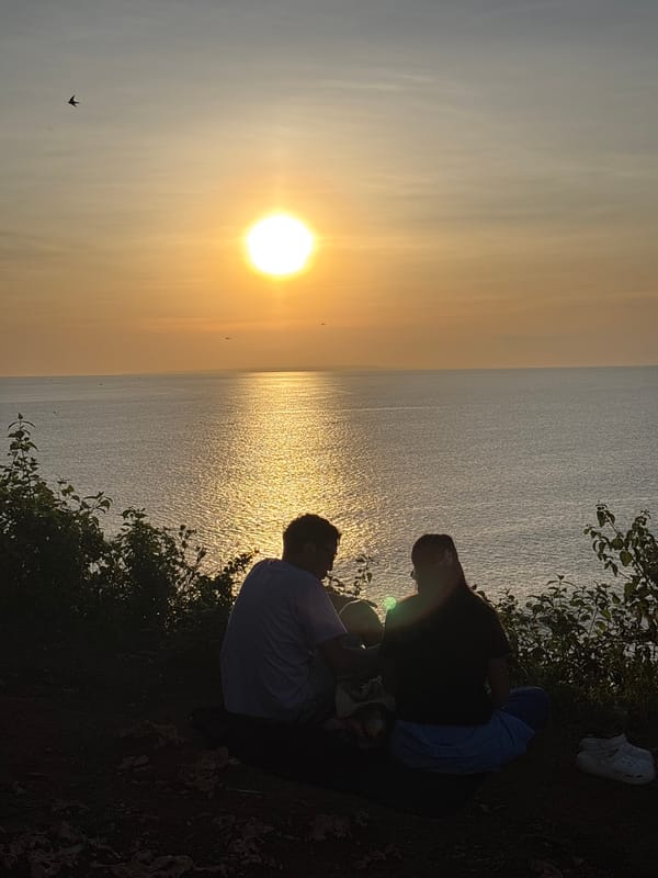 Sunset watchers gather at Kuta Selatan clifftops overlooking ocean