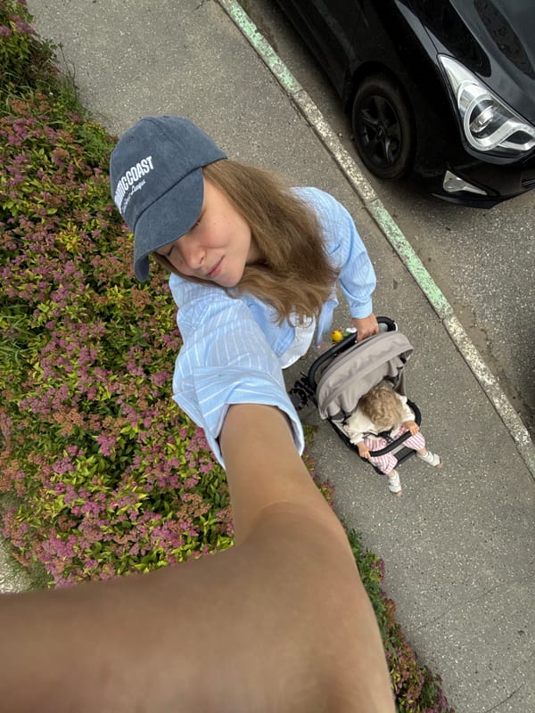 Stroller outing on a Vladimir sidewalk, summer morning