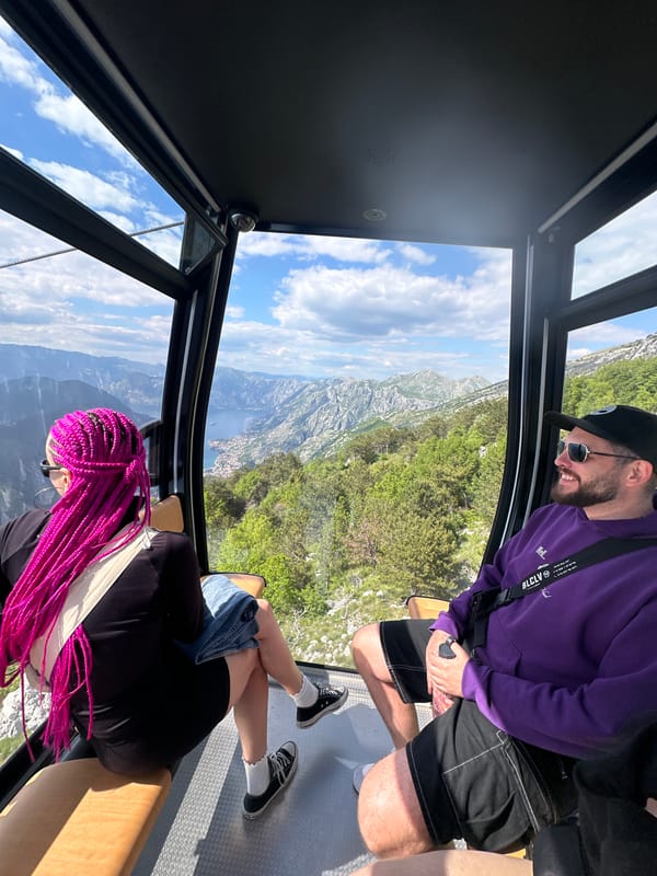 Cable car riders capture scenic Bay of Kotor views