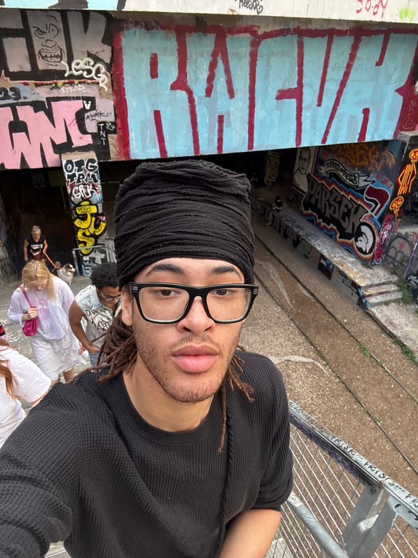 Young adults explore graffiti-covered Paris railway underpass