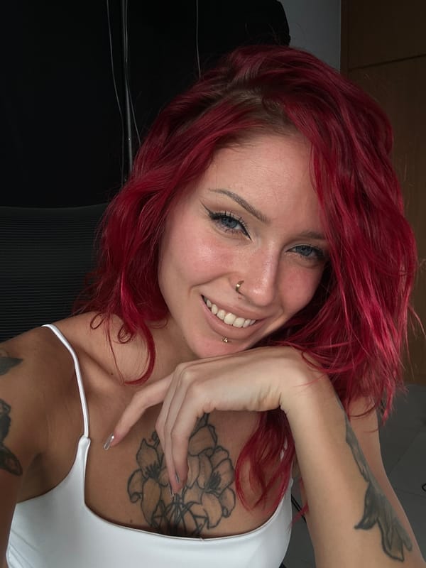 Tattooed woman photographed indoors in North Kuta, Indonesia