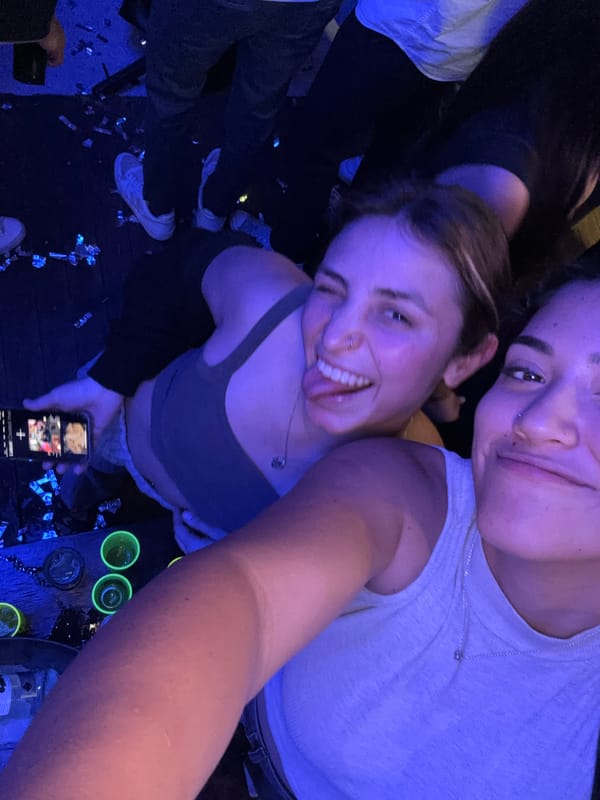 Women Take Selfies at Nighttime Party in Cholula