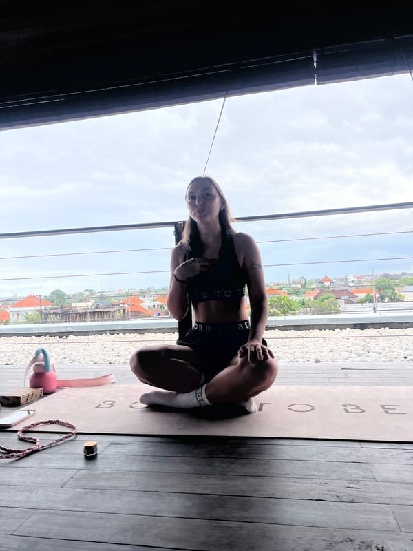 Woman practices yoga indoors in Mengwi, Indonesia