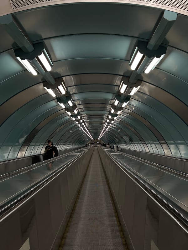 Riding the deep escalators at Krestovsky Ostrov metro station