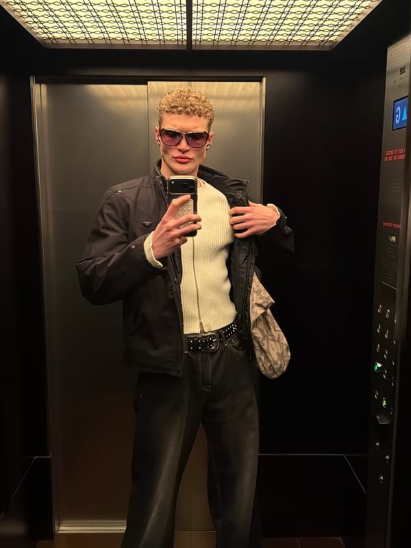 Young person photographed wearing sunglasses in London morning