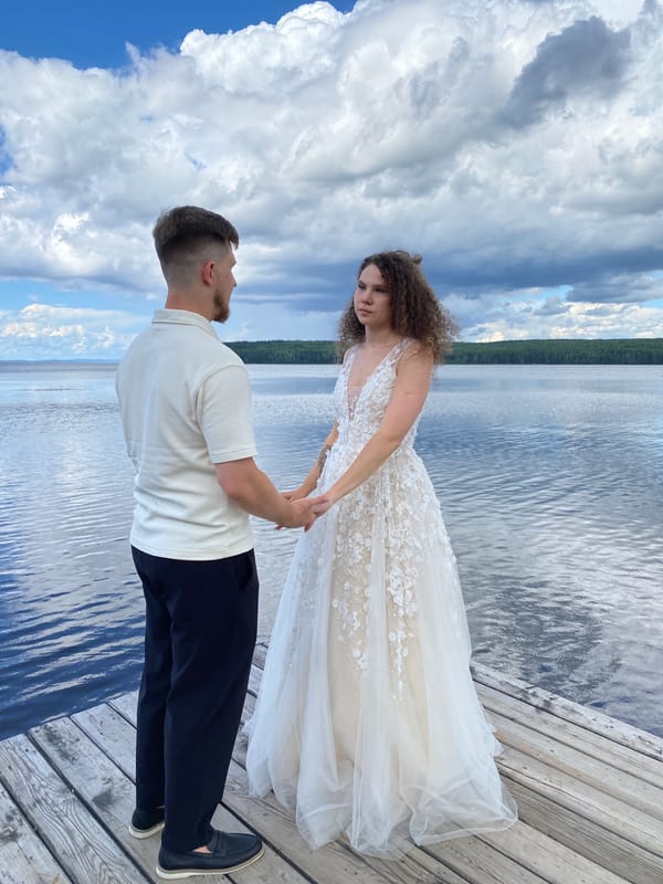 Wedding shoot on a lakeside pier in Chaikovsky, Russia