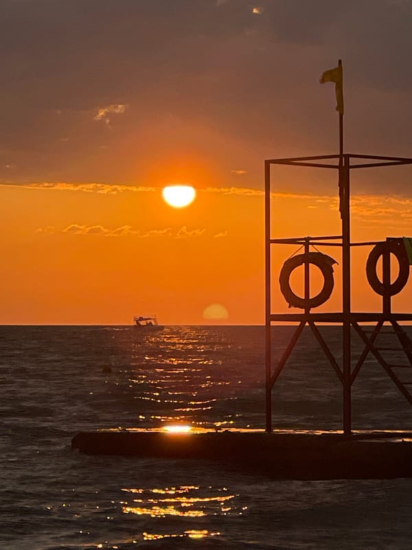 Dramatic sunset observed over pebble beach in Razdolnoye, Russia