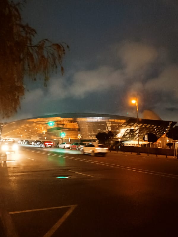 Evening street scenes documented around illuminated Baku landmarks