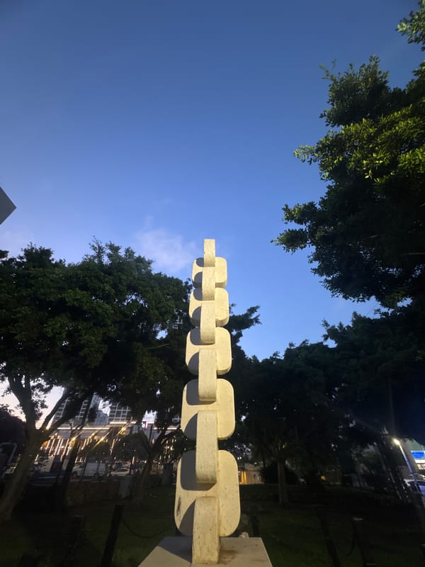 Afternoon at a Bat Yam park with a large sculptural landmark