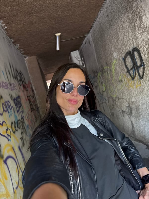 Woman takes selfie in graffiti-covered tunnel in Pleven, Bulgaria
