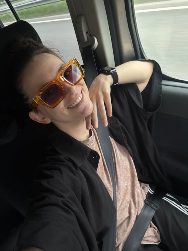 Person in orange sunglasses observed traveling by car in Shali