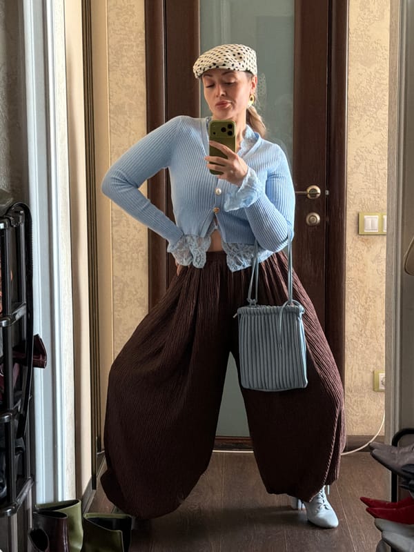 Woman takes mirror selfie indoors in Krasnoyarsk, Russia