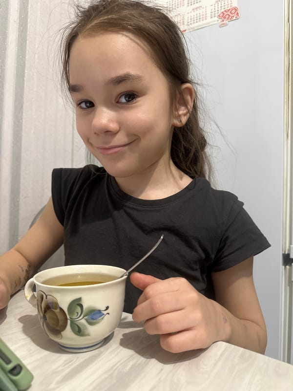 Young girl uses tablet indoors in Uva, Russia