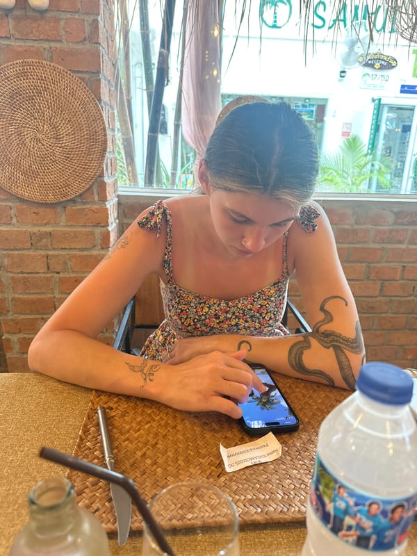 Woman dines alone at early morning cafe in Thailand