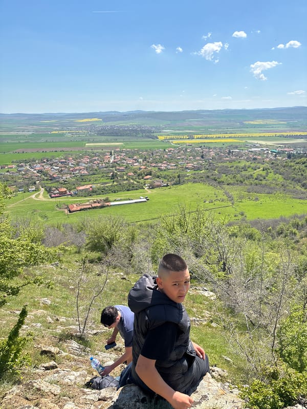 Boy in black vest spotted on rocky outcrop in Goritsa