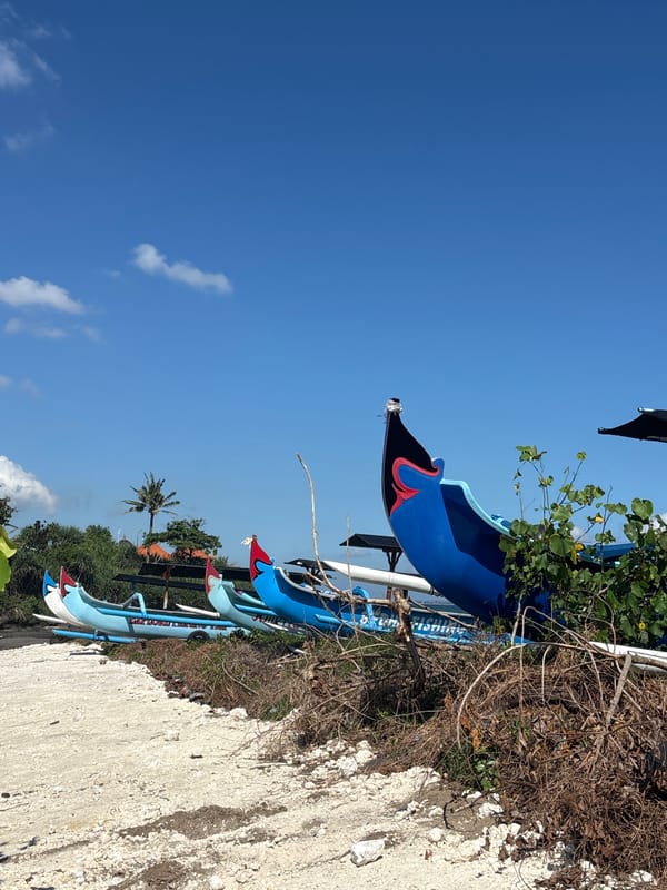 Cemagi's black sand beach and traditional fishing boats, Mengwi