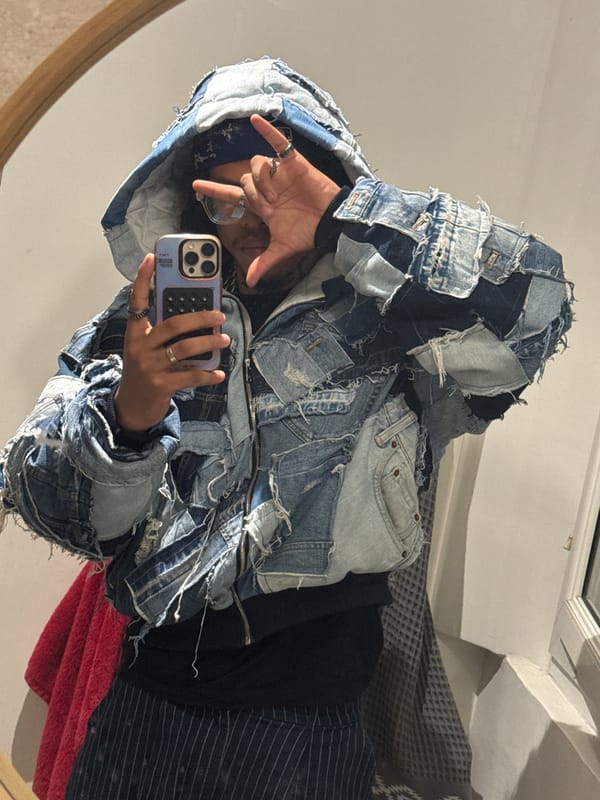 Person takes mirror selfie in denim jacket, Massy France