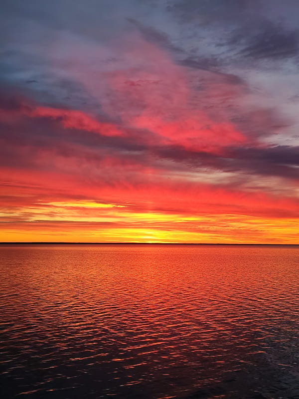 Vibrant sunset over Russian waters captured in photographs