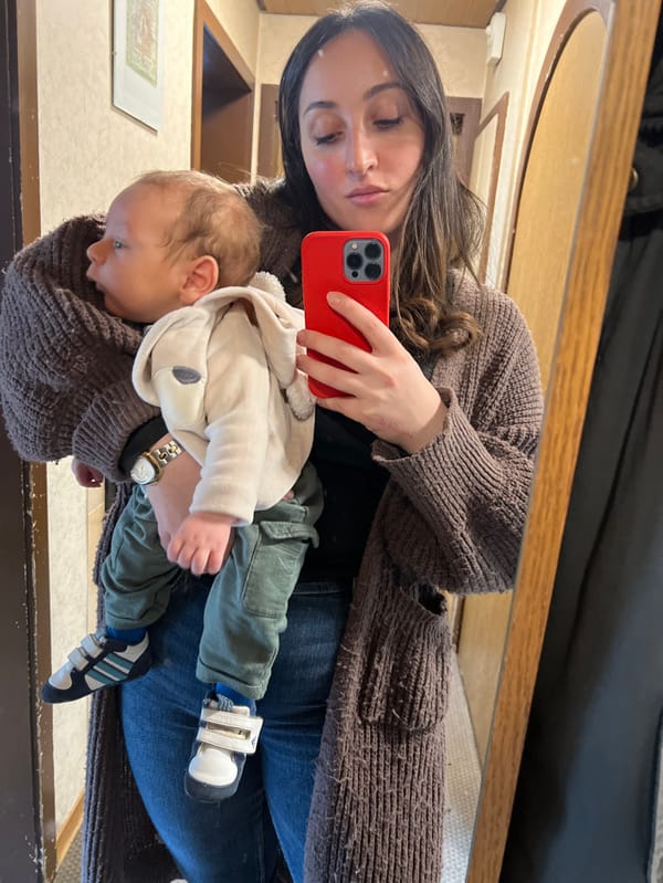 Mother holds infant during quiet moment in Wüstenrot, Germany