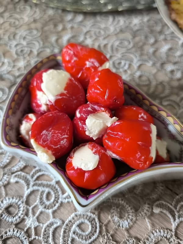 Lithuanian home meal featuring stuffed peppers and fish documented