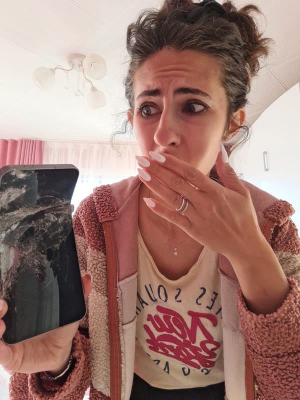 Woman deals with cracked phone, replacement in Bulgarian village
