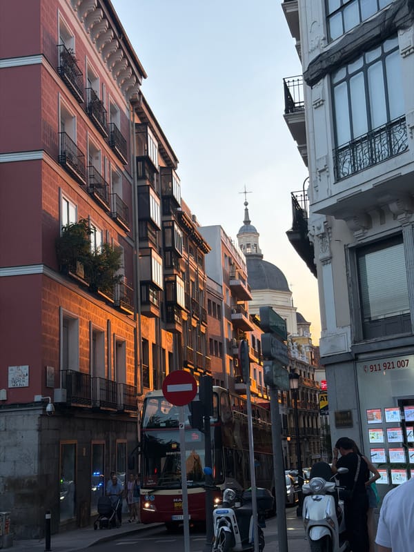 Madrid street scene glows under a summer evening sun