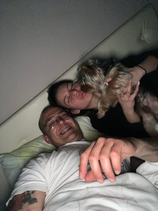 Couple shares quiet evening at home with Yorkshire Terrier