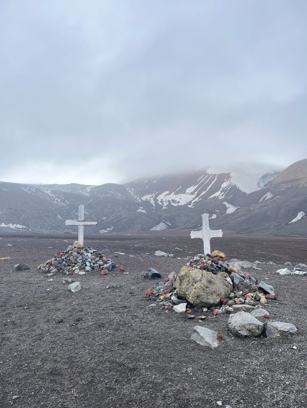 Antarctic base decay documented amid overcast mountain landscape