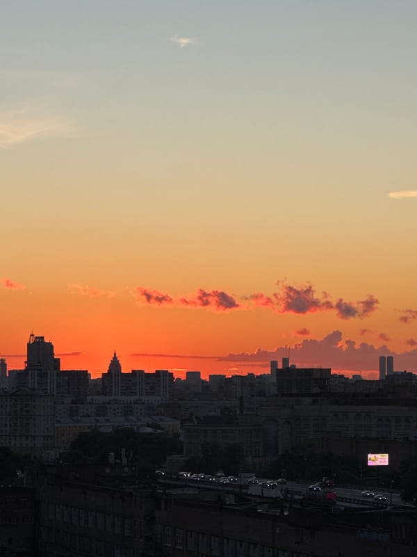 Moscow skyline glows through a warm summer sunset