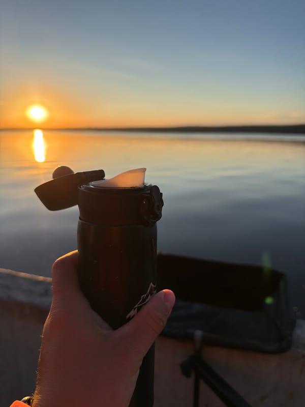 Thermos in hand, sunset over the water in Chaikovsky