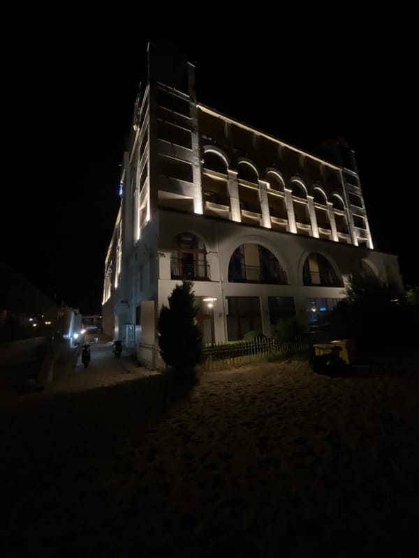 Summer night on Obzor's beachfront: hotels, moon, and promenade