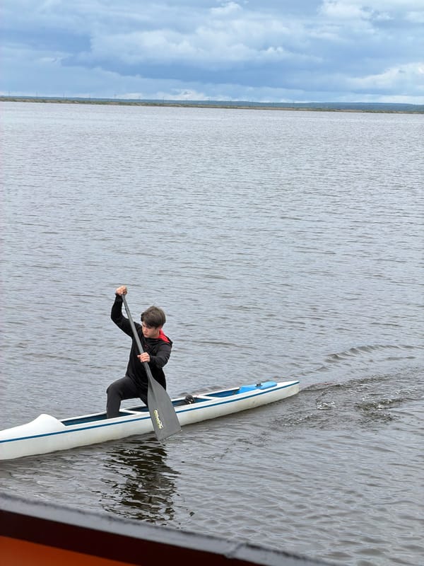 Kayakers enjoy afternoon recreation on Kama River in Chaikovsky