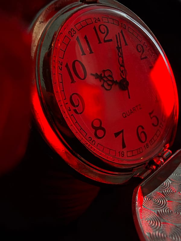 Gothic Photography Session Features Red Candles, Pocket Watches, Skulls