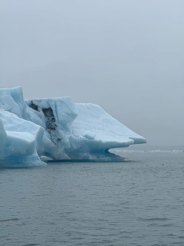Tourists explore icebergs at Iceland's Jokulsarlon glacial lagoon
