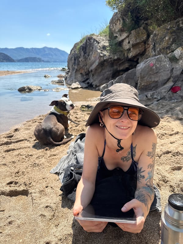Woman with dog enjoys morning beach time in Montenegro