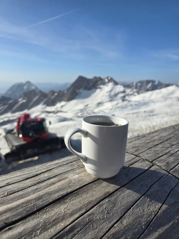 Morning coffee overlooking snowy Alps in Garmisch-Partenkirchen