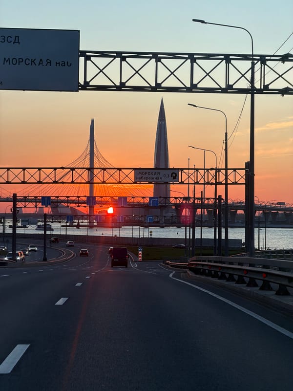 Sunset drive across Saint Petersburg bridge captures city skyline