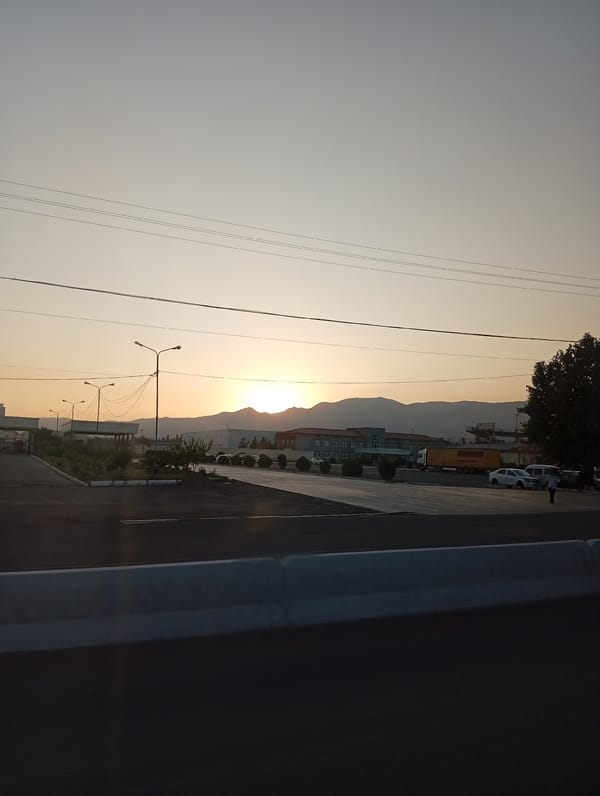 Dusk drive along an open road in Angren, Uzbekistan