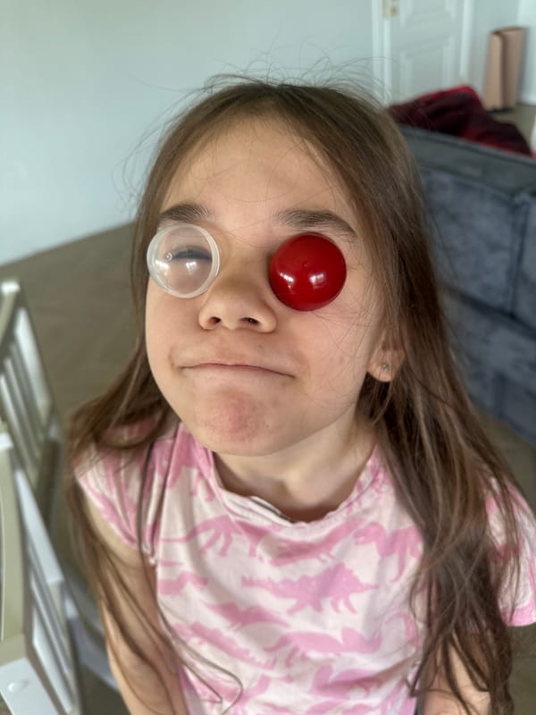 Girl photographed with red spherical object in Kharnavy, Russia