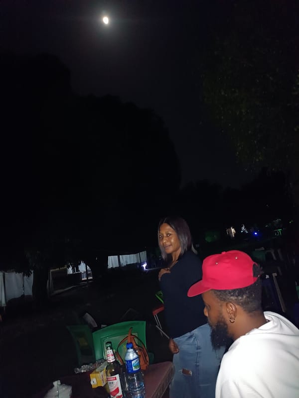 Late-night hangout under a full moon in Jos, Nigeria