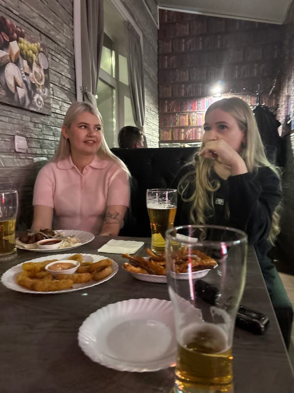 Two women dine together at Ust-Ilimsk restaurant